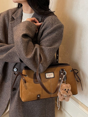handbag in camel featuring side ties and boxy fit