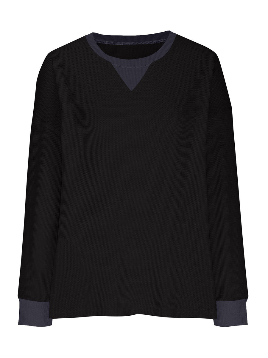 Black waffle knit raglan sleeve sweatshirt with contrast V-neck detail and cuffs.