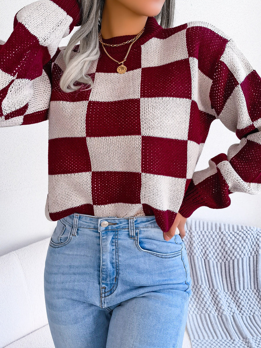 Burgundy and cream checkerboard knit mock neck pullover sweater with open knit detail.