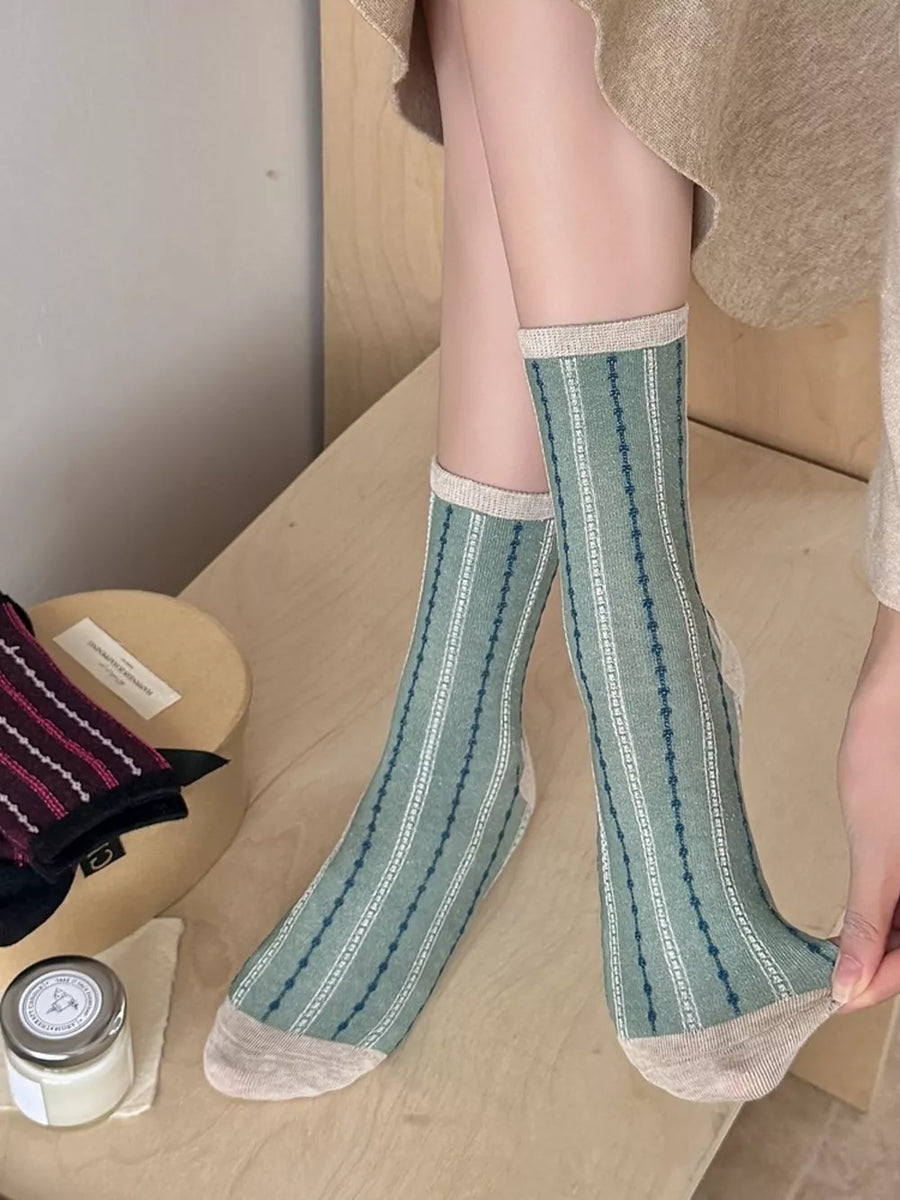 socks in sage green featuring mid-calf length and fitted fit