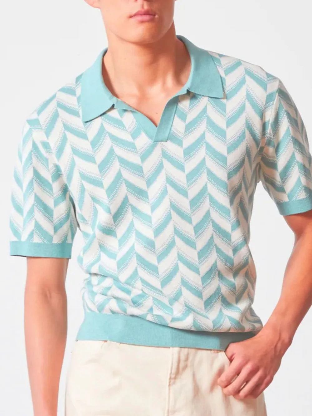 Chevron knit polo shirt in pastel blue with V-neck collar and short sleeves.