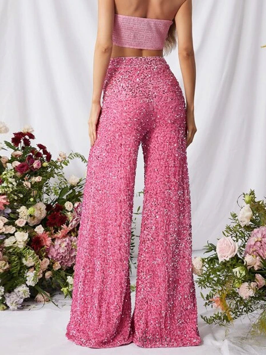 Pink sequin wide leg pants with a flowy, elegant cut.