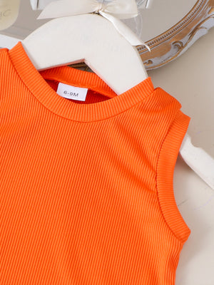 Orange ribbed cotton baby tank top with a size tag.