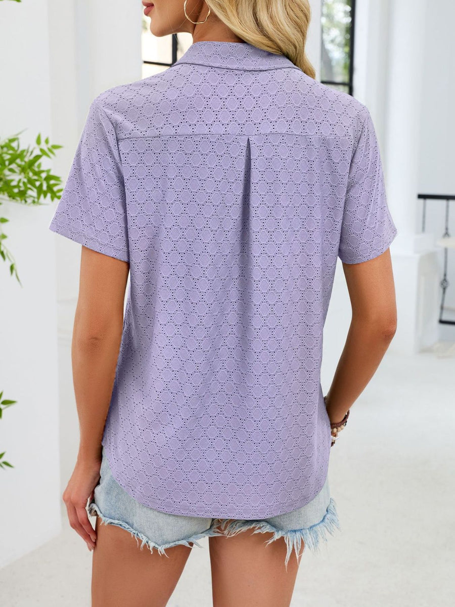 Lavender eyelet polo collar blouse with short sleeves and a back pleat detail.