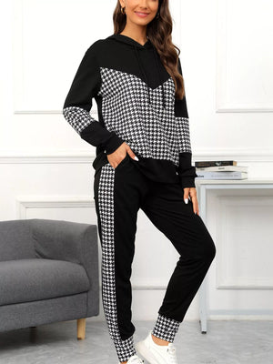 Black houndstooth hoodie and pants set with drawstring and contrast panels.