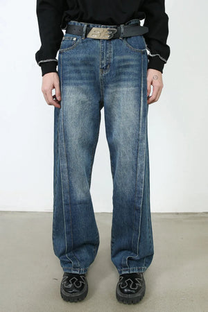 Medium wash denim wide leg jeans with vertical seams and a relaxed fit.