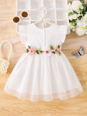 White baby dress with floral appliqué belt, ruffle sleeves, and button front.