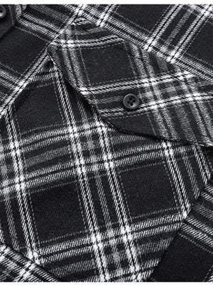 Men's black and white plaid button-up shirt with chest pocket detail.