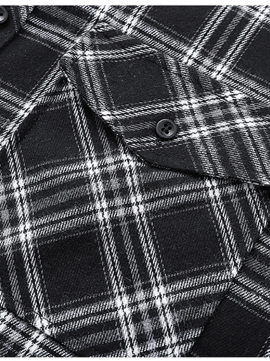 Men's black and white plaid button-up shirt with chest pocket detail.