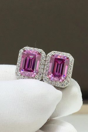 Emerald cut moissanite halo stud earrings in rose gold with pink center stones.