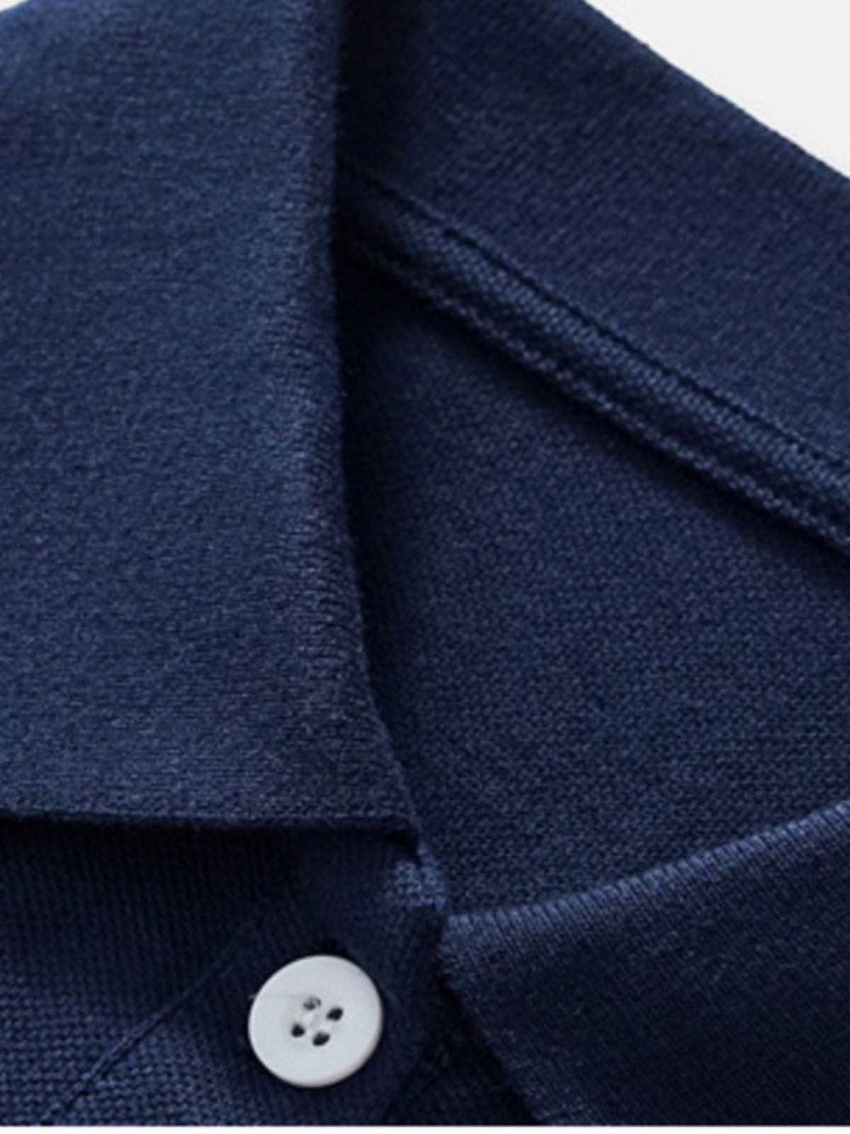 Navy blue cotton toddler polo shirt with white button detail