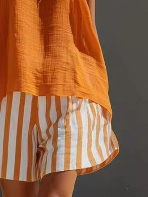 Orange textured tank top with white and orange striped shorts
