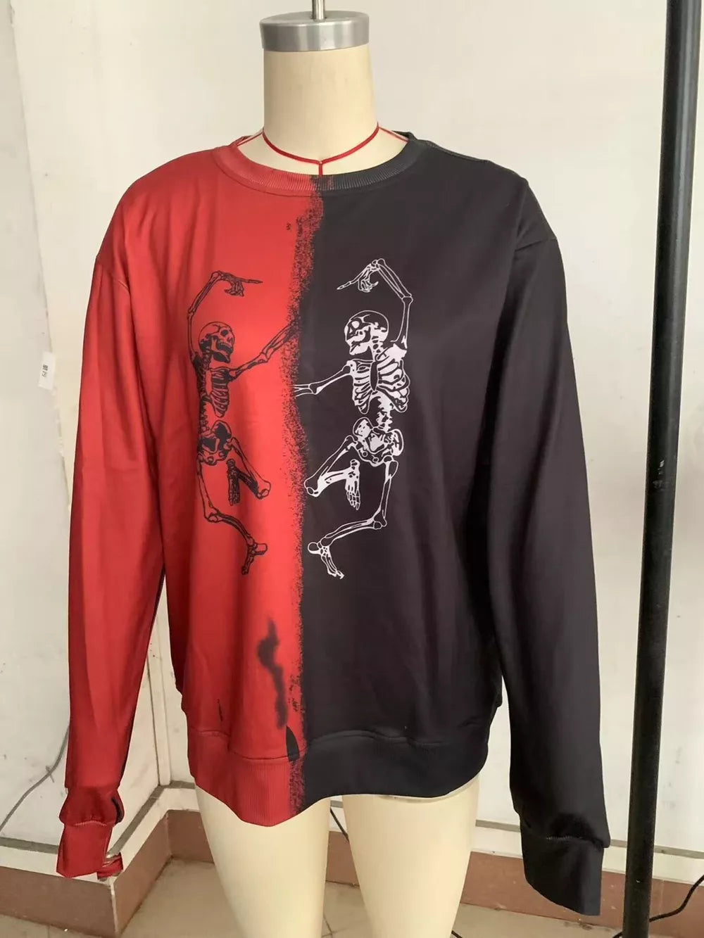 sweatshirt in orange with color-block and skeleton print