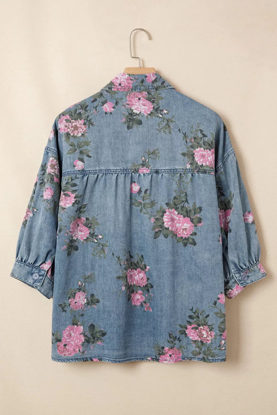 Denim button-up blouse with pink floral print, puff sleeves, and gathered back detail.