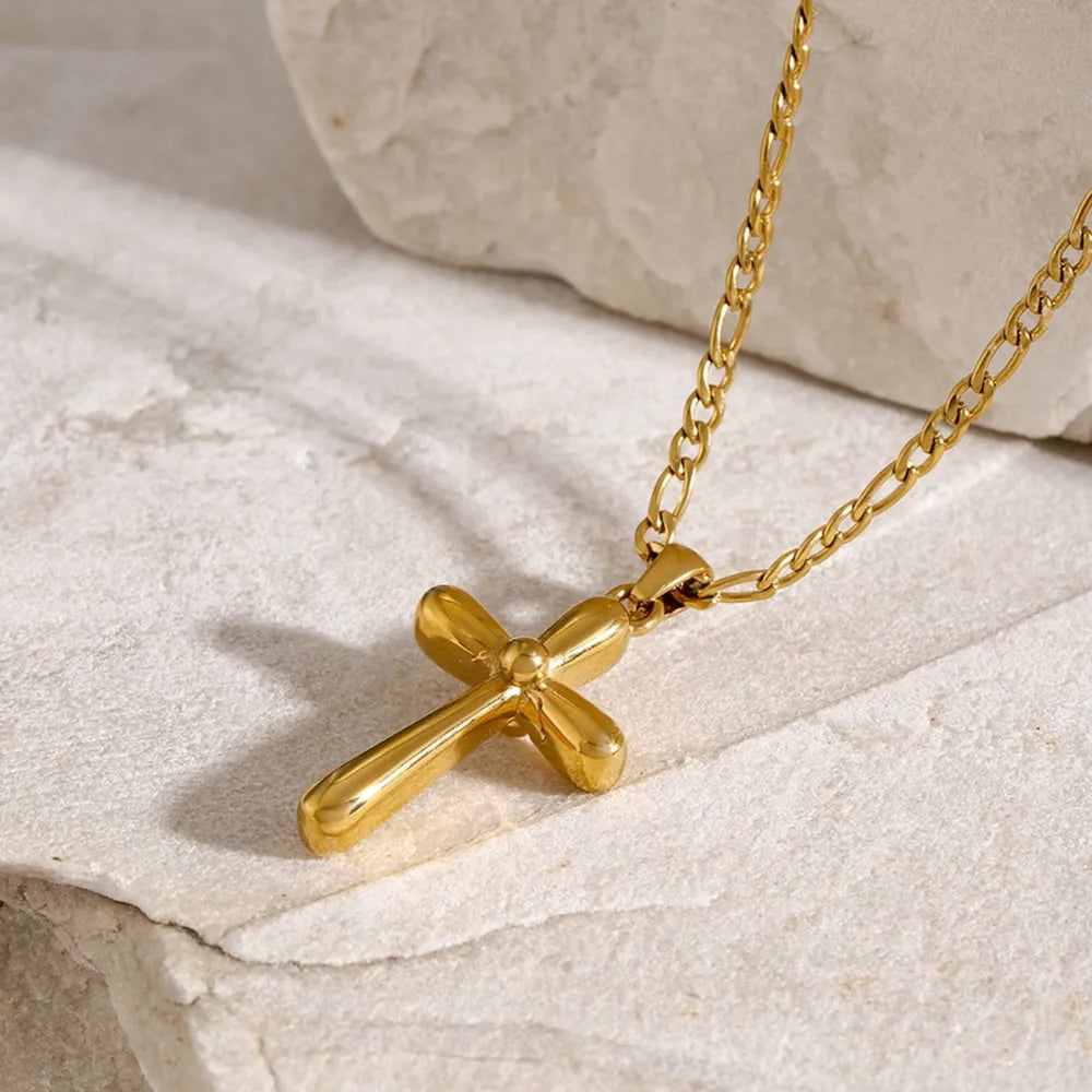 Gold sculpted cross pendant necklace with figaro chain, 18K gold-plated.