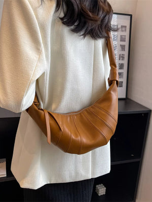 Chic Crescent Hobo Crossbody Bag in brown with a pleated texture and single strap.