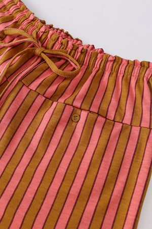 Wide leg pants with pink and brown stripes, drawstring waist, and button pocket detail.