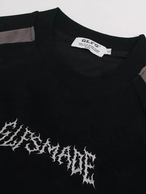 Black athletic t-shirt with embroidered graphic and grey shoulder details.