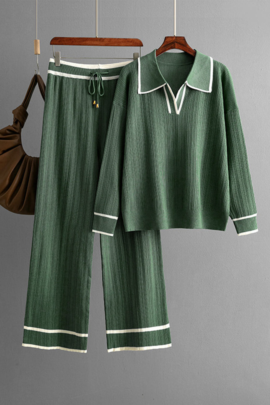 Dark green ribbed knit loungewear set with contrast trim, collared v-neck top and wide leg pants.