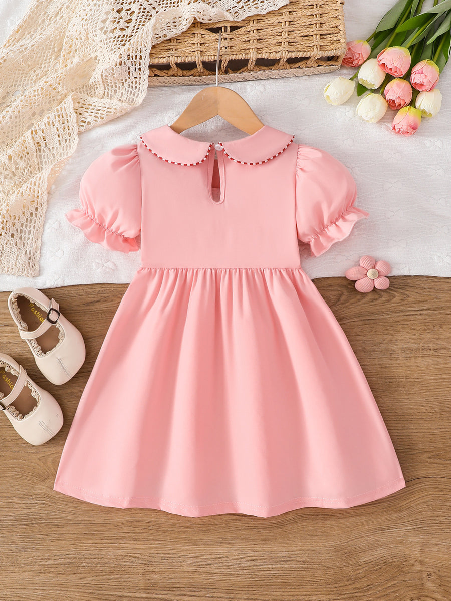 A-line dress in Pink with embroidered and smocked