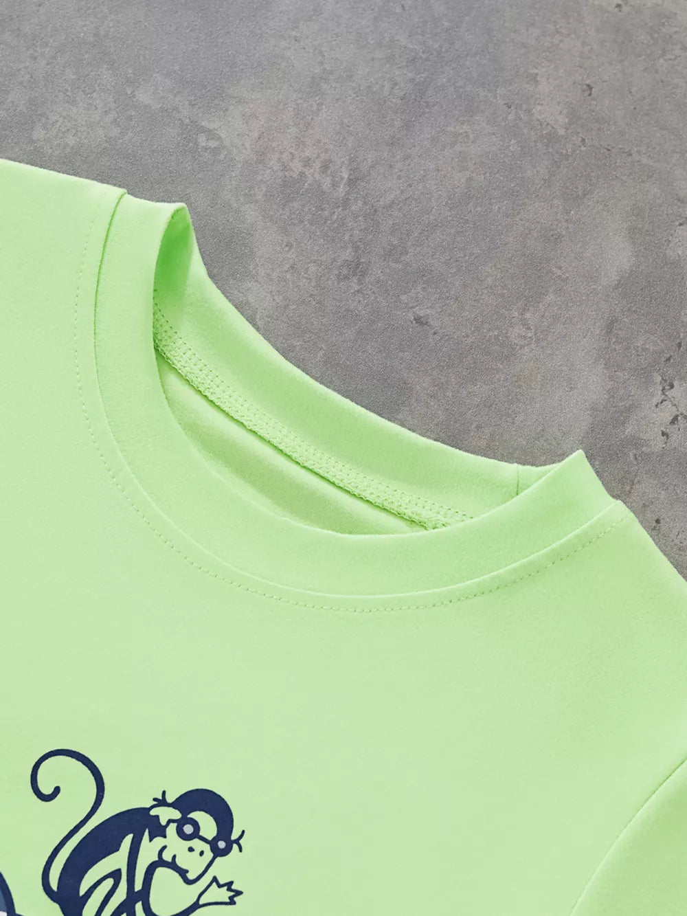 Light green crewneck t-shirt with navy monkey graphic print