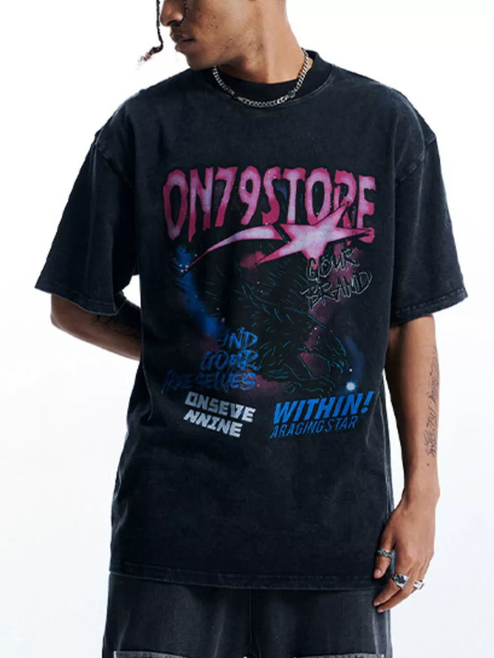 Black oversized graphic tee with cosmic print and crew neck.