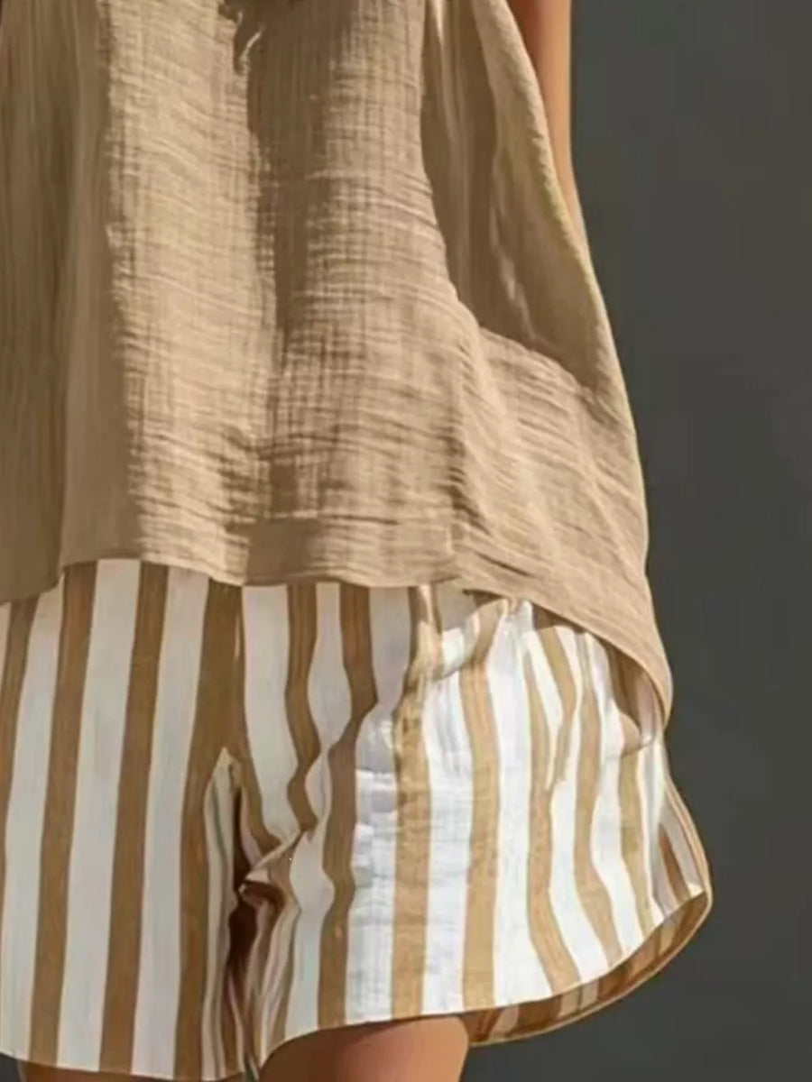 Striped shorts in white and tan with a beige gauze tank top.