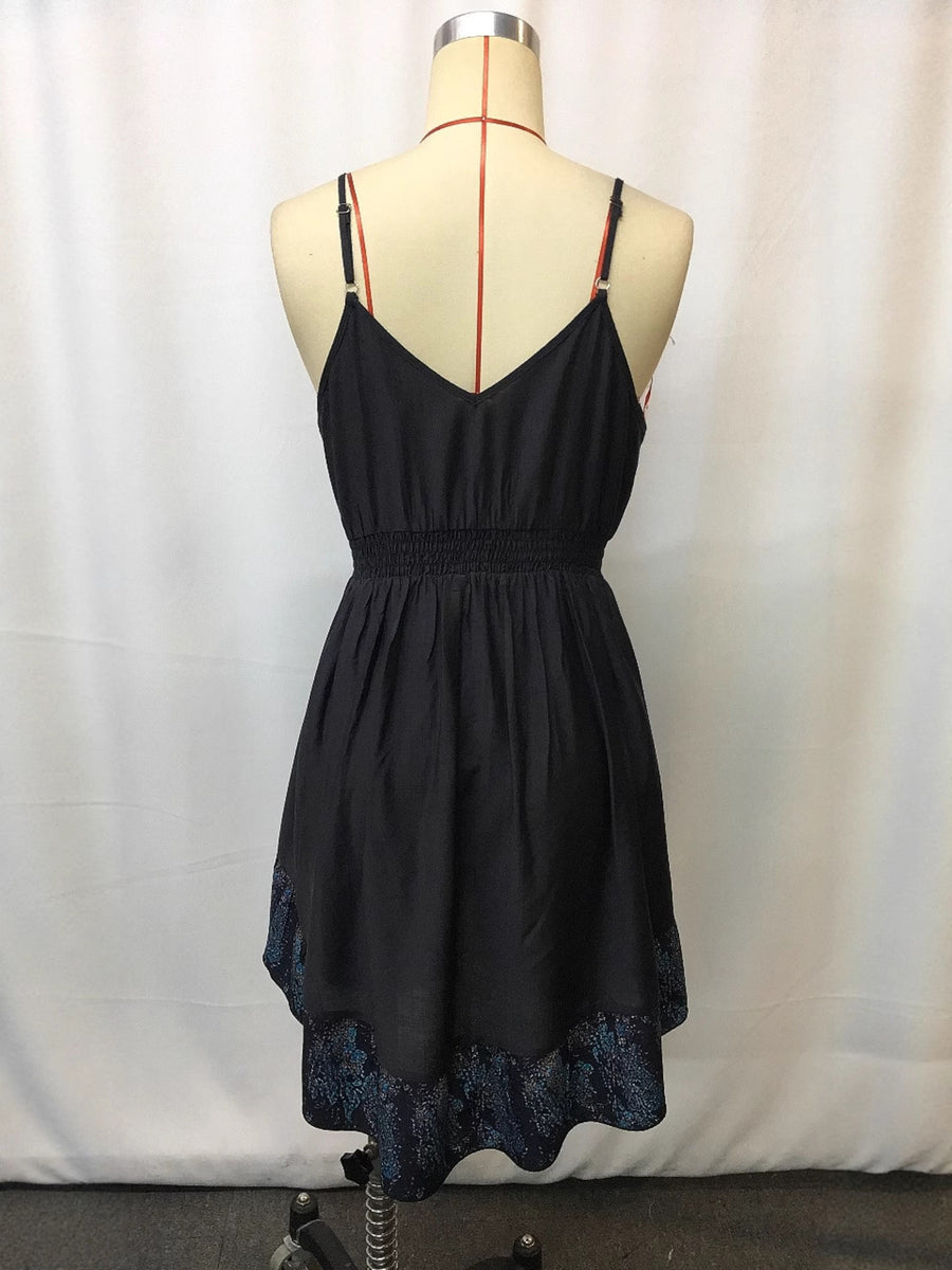 Black cami mini dress with smocked waist and floral print hem