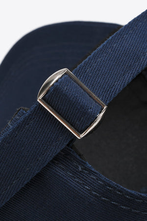 Navy cotton twill baseball cap with adjustable strap and silver buckle detail.