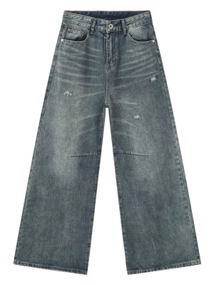 Distressed edge wide-leg jeans in medium wash denim with a relaxed fit.
