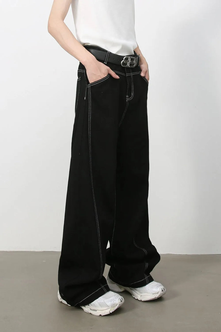 Black relaxed fit jeans with contrast stitching and a wide leg