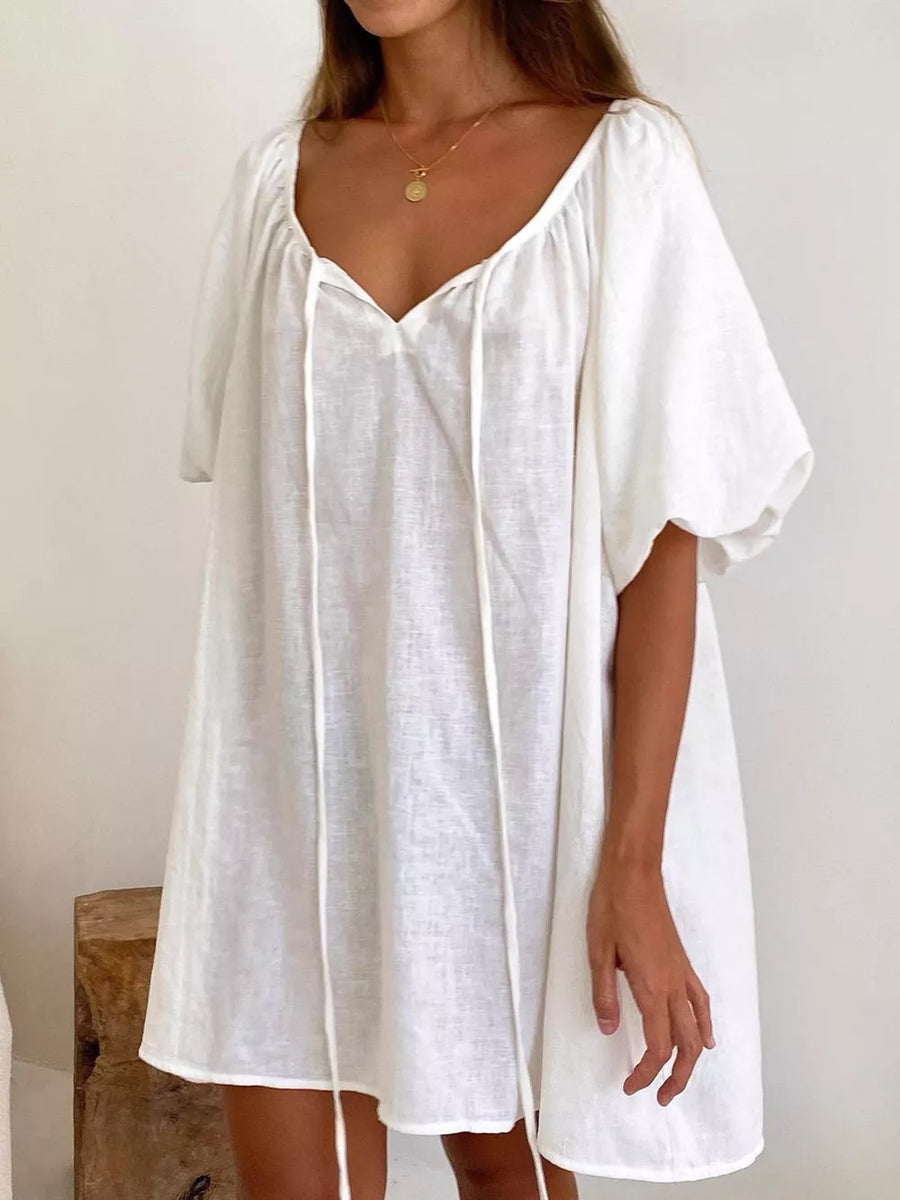 100% polyester Care instructions: Machine wash cold mini dress in White with relaxed silhouette
