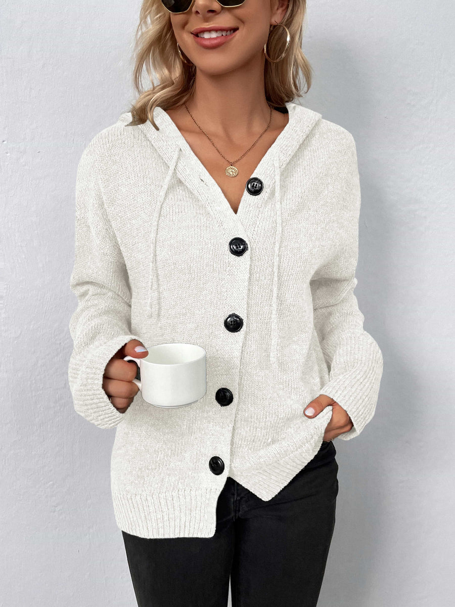 White button-front hooded knit cardigan with drawstring and black buttons.