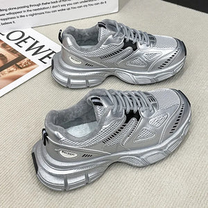 Silver lace-up sport platforms with plush lining and breathable mesh detailing.