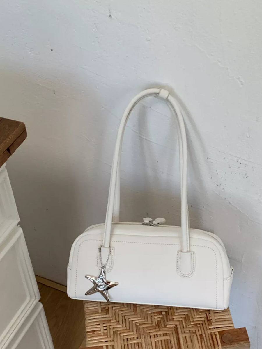 White leather shoulder bag with star charm detail