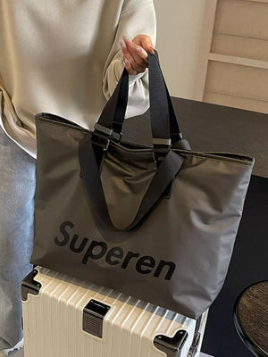 Spacious grey Oxford cloth travel shoulder bag with black straps and "Superen" logo.