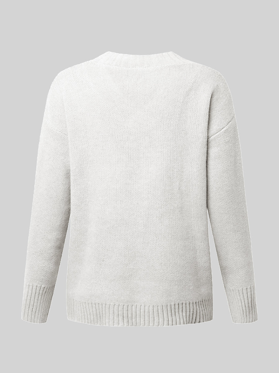 White ribbed trim V-neck knit sweater with long sleeves and ribbed cuffs and hem.