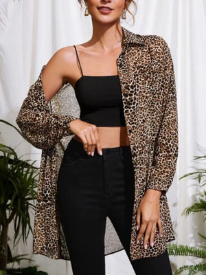 Leopard print oversized button-up shirt with a collared neckline and long sleeves.