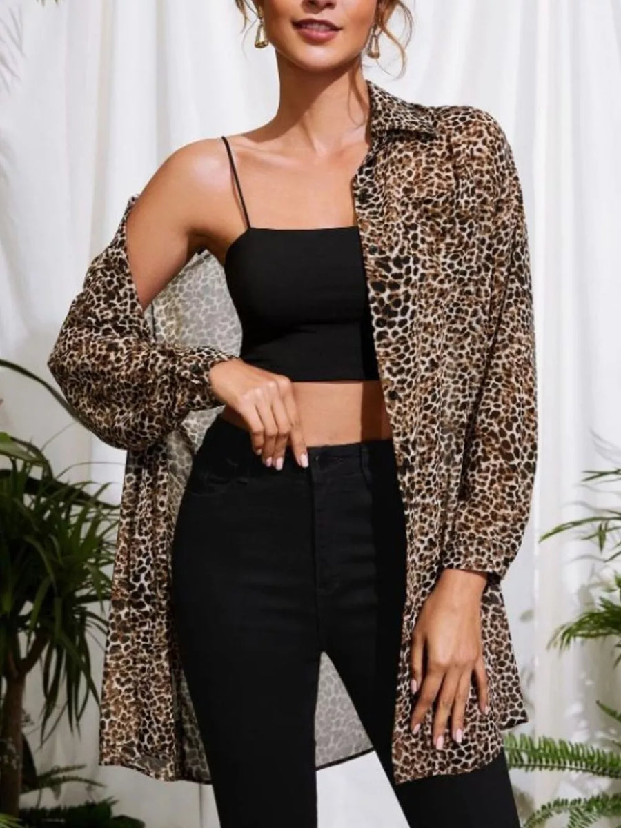 Leopard print oversized button-up shirt with a collared neckline and long sleeves.