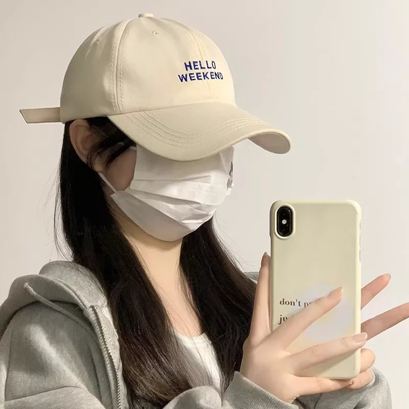 Beige cotton baseball cap with blue "HELLO WEEKEND" embroidery