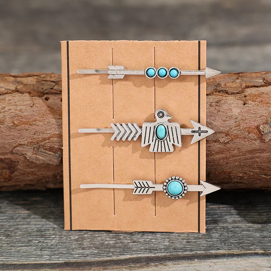 Southwestern hair pins with turquoise accents, featuring arrow and thunderbird designs.