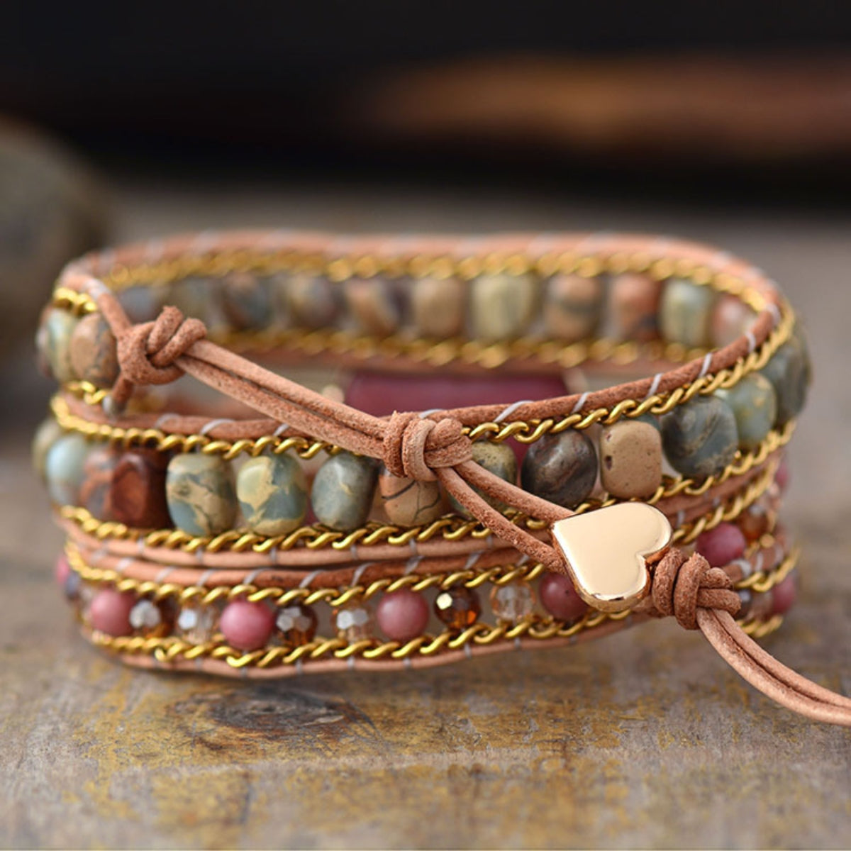 Bohemian multicolor wrap bracelet with beads, gold chain, and heart charm.