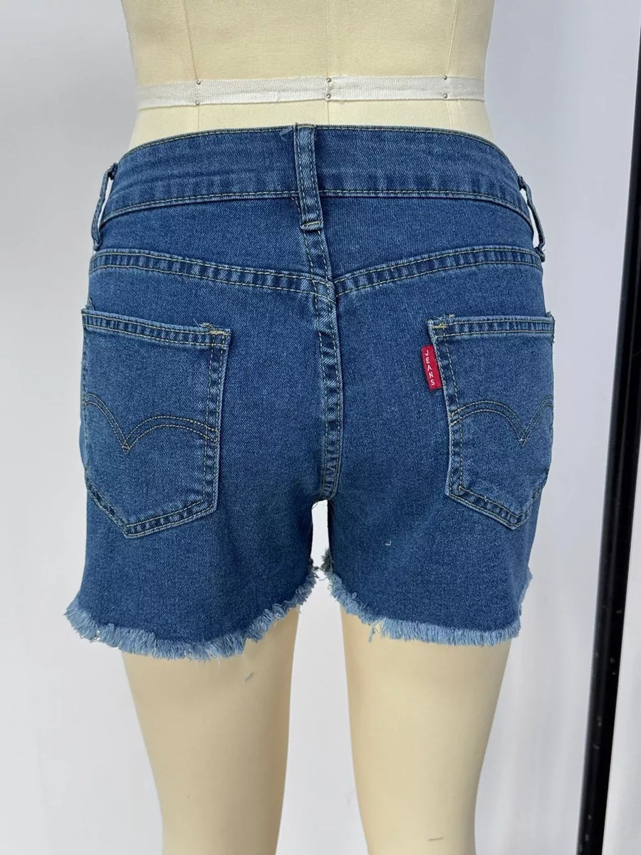 Classic blue denim shorts with frayed hem and button fly.