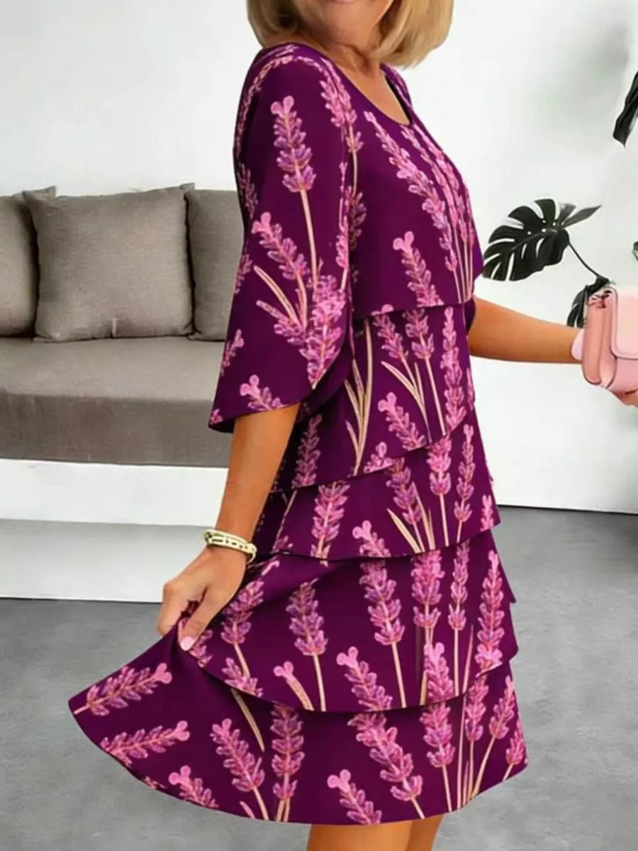 Purple floral tiered ruffle hem dress with short sleeves and above-knee length.