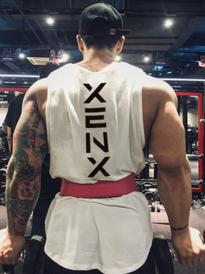 White athletic tank top with black Kanji graphic on back, worn by a man lifting weights.