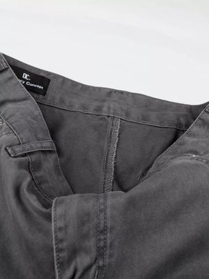 Men's relaxed fit grey cotton cargo capris with button closure and visible stitching details.
