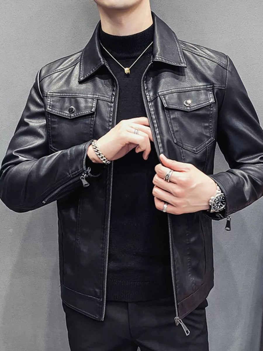 Men's black faux leather trucker jacket with chest pockets and zip closure.