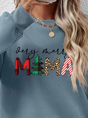 French Blue crewneck sweater with Merry Mama graphic, featuring plaid, tree, leopard, and stripe patterns.