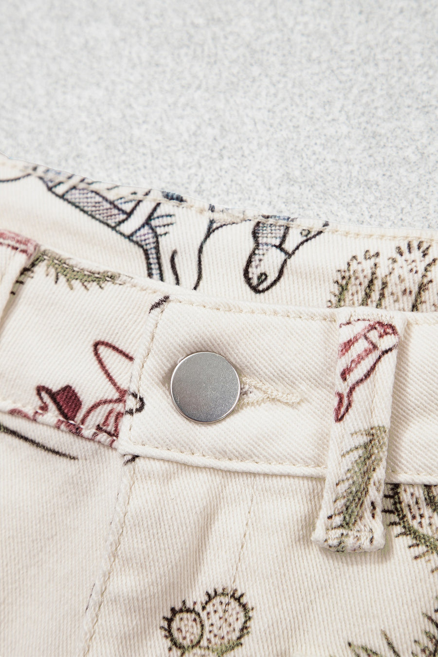 jeans featuring western print in sage green with 98% cotton, 2% elastane Care instructions: Machine wash cold texture