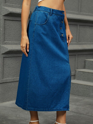 Button-front denim A-line midi skirt in medium blue with side slit and pocket detail.